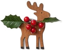 a reindeer with holly and berries on its nose.jpg